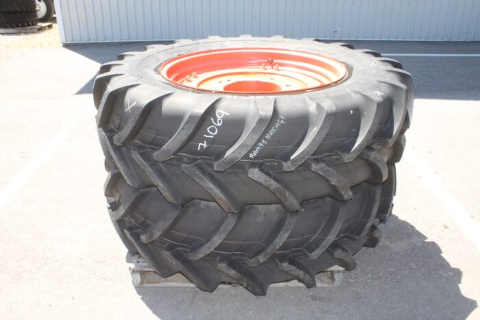Michelin Pair of 420/85R34 tires on 8 bolt cast Kubota OEM rim, 100% tread, 6"pilot, 8" bolt circle, orange