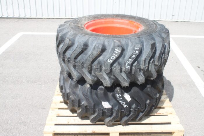 Titan pair of 15x19.5 on Kubota rim, 100% tread