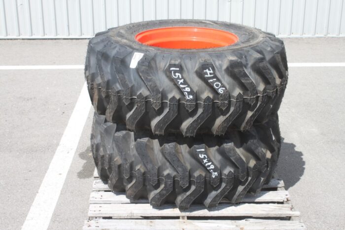 Titan pair of 15x19.5 on Kubota rim, 100% tread