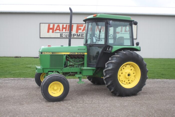 JD 2550 2wd tractor, cab, air, 2 remotes, Hi/Lo, 18.4x30, R&P axle, 3377 hours, one owner